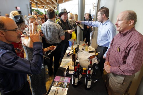 BORIS MINKEVICH / WINNIPEG FREE PRESS California Wine Festival at Assiniboine Park's Qualico Family Centre. California wine man John Wetzels of Alexander Valley Vineyards, right, engages some wine lovers attending the event. April 27, 2016