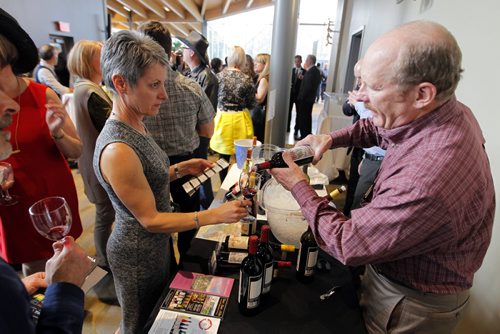 BORIS MINKEVICH / WINNIPEG FREE PRESS California Wine Festival at Assiniboine Park's Qualico Family Centre. California wine man John Wetzels of Alexander Valley Vineyards, right, engages some wine lovers attending the event. April 27, 2016
