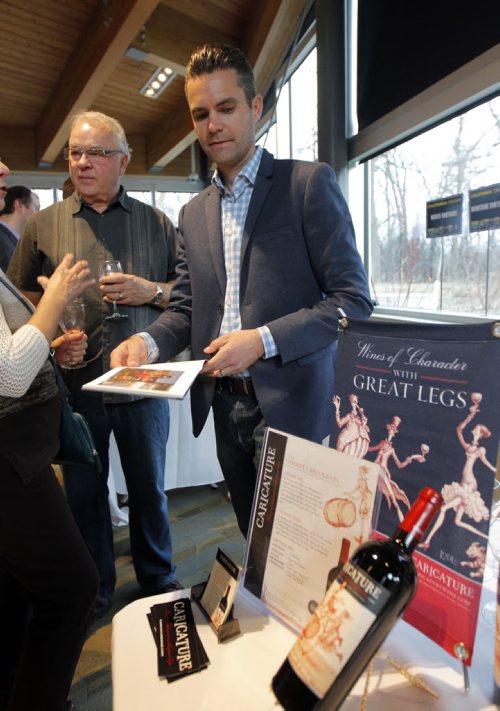 BORIS MINKEVICH / WINNIPEG FREE PRESS California Wine Festival at Assiniboine Park's Qualico Family Centre. California winery owner Joseph C. Lange, right, of LangeTwins family winery and Vineyards sells his wine to some wine lovers attending the event. April 27, 2016