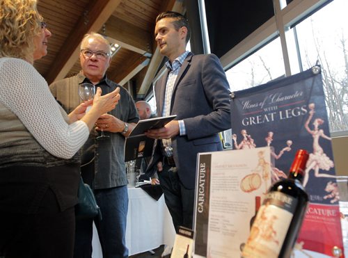 BORIS MINKEVICH / WINNIPEG FREE PRESS California Wine Festival at Assiniboine Park's Qualico Family Centre. California winery owner Joseph C. Lange, right, of LangeTwins family winery and Vineyards sells his wine to some wine lovers attending the event. April 27, 2016
