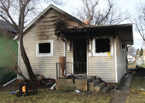 WAYNE GLOWACKI / WINNIPEG FREE PRESS   One of the three houses and a garage in the 1400 block of Pacific Ave. West that were heavily damaged by an overnight fire. Bill Redekop story  April 28 2016