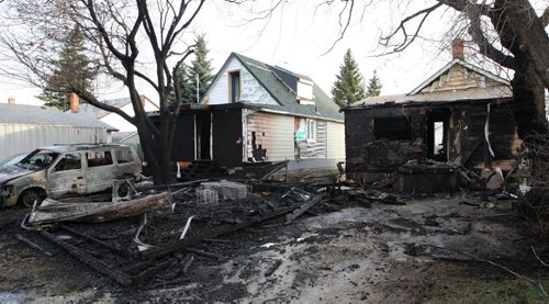 WAYNE GLOWACKI / WINNIPEG FREE PRESS   Three houses and a garage in the 1400 block of Pacific Ave. West were heavily damaged by an overnight fire. Bill Redekop story  April 28 2016
