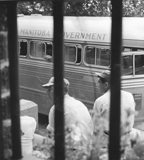 Headingley Jail, July 20, 1956.  Scanned from photograph.  Inmates who have finished their terms wait for bus to take them to Wnnipeg and freedom.
