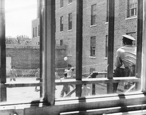 Headingley Jail, July 20, 1956.  Scanned from photograph.  Inmates play volleyball in the exercise yard.