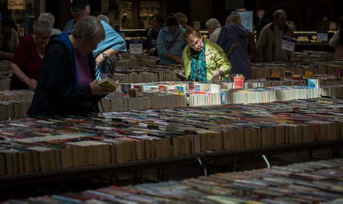 MIKE DEAL / WINNIPEG FREE PRESS Dianna Henzel (green jacket) browses through books at the Children's Hospital Book Market at St. Vital Shopping Centre which will be running until the afternoon of Saturday, April 30th.  160428 - Thursday, April 28, 2016