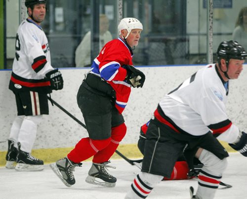 BORIS MINKEVICH / WINNIPEG FREE PRESS Battle of the Badges police fundraising tournament. Former Winnipeg Jets player from the old days Doug Smail, middle with white helmet,  plays with The Pint team on the ice at Southdale Arena. April 29, 2016