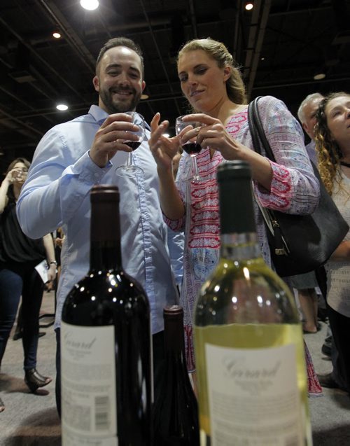 BORIS MINKEVICH / WINNIPEG FREE PRESS Wine Festival 2016 - Tyler Schultz and Jenn Star enjoy some wine from Napa Valley's Girard Winery at the RBC Convention Centre wine tasting event. April 29, 2016