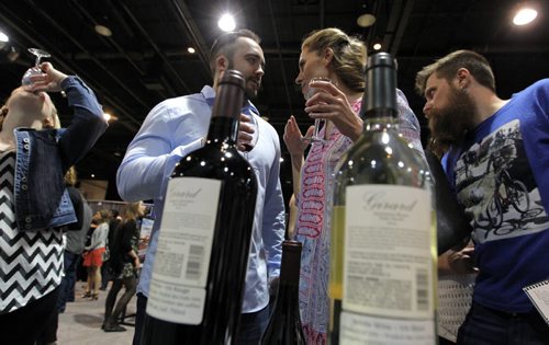BORIS MINKEVICH / WINNIPEG FREE PRESS Wine Festival 2016 - Tyler Schultz and Jenn Star enjoy some wine from Napa Valley's Girard Winery at the RBC Convention Centre wine tasting event. April 29, 2016