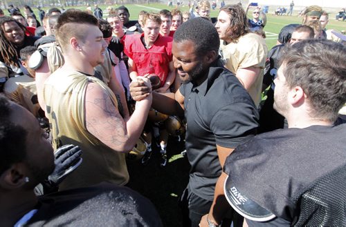 BORIS MINKEVICH / WINNIPEG FREE PRESS Bison football defensive lineman David Onyemata after his selection in the NFL Draft. He was celebrated by all the Bison Football players after practice today at the University of Manitoba turf field. April 30, 2016