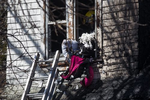MIKE DEAL / WINNIPEG FREE PRESS A house fire in the 1200 block of Manitoba Ave. sent one person to hospital in unstable condition while eight other residents were checked at the scene and released. Unknown cost of damage, fire investigators have not ruled out arson yet. 160501 - Sunday, May 01, 2016