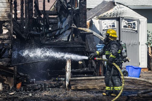 MIKE DEAL / WINNIPEG FREE PRESS A house fire in the 1200 block of Manitoba Ave. sent one person to hospital in unstable condition while eight other residents were checked at the scene and released. Unknown cost of damage, fire investigators have not ruled out arson yet. 160501 - Sunday, May 01, 2016