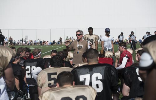 DAVID LIPNOWSKI / WINNIPEG FREE PRESS  Winnipeg Bisons Football head coach Brian Dobie speaks to players during the University of Manitoba Bisons 2016 spring camp prior to a scrimmage to close out their camp Sunday May 1, 2016 at the University of Manitoba Turf Fields.