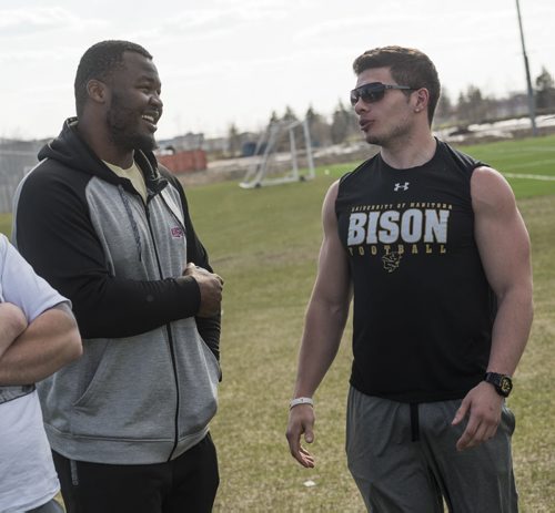 DAVID LIPNOWSKI / WINNIPEG FREE PRESS  Former University of Manitoba Bisons' David Onyemata( left) and  DJ Lalama at the University of Manitoba Bisons 2016 spring camp Sunday May 1, 2016 at the University of Manitoba Turf Fields. David Onyemata is the first Bison to be drafted into the NFL and DJ Lalama just signed on to go to New York Giants mini-camp.