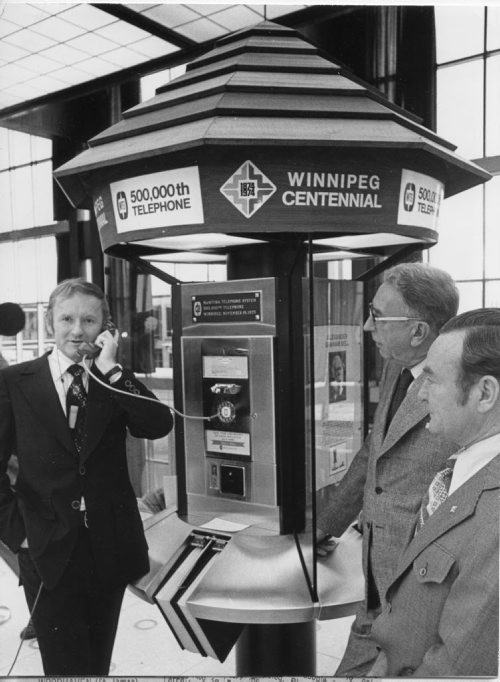 WINNIPEG FREE PRESS FILES Ian Turnbull, minister responsible for the Manitoba Telephone System, places the first long distance call on the province's 500,000th telephone. Mr. Turnbull received congratulations from Communications Minister Gerard Pelletier in Ottawa. November 20, 1973