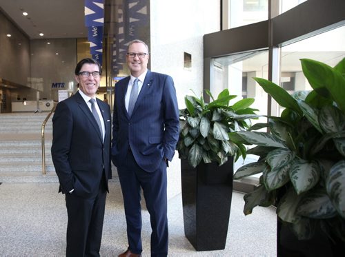 RUTH BONNEVILLE / WINNIPEG FREE PRESS    Biz:MTS CEO Jay Forbes (left)  and  George Cope, the CEO of BCE (Bell Canada Enterprises) have their photo taken together in  the lobby of  MTS Building on Main and Portage after signing  big deal announcing Bell ownership of MTS.     May 03, , 2016