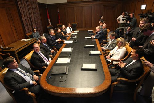 WAYNE GLOWACKI / WINNIPEG FREE PRESS Manitoba Progressive Conservative cabinet sit for the first time in  the Manitoba Legislative Bld. Tues. and invite media in for questions. At left, Ian Wishart, Scott Fielding, Blaine Pedersen,  Premier Brian Pallister, Heather Stefanson  Rochelle Squires and Eileen Clarke. At table at right is Ron Schuler, Cathy Cox, Cameron Friesen, Kelvin Goertzen, Ralph Eichler and  Cliff Cullen. Nick Martin, Dan Lett, Larry Kusch stories    May 3  2016