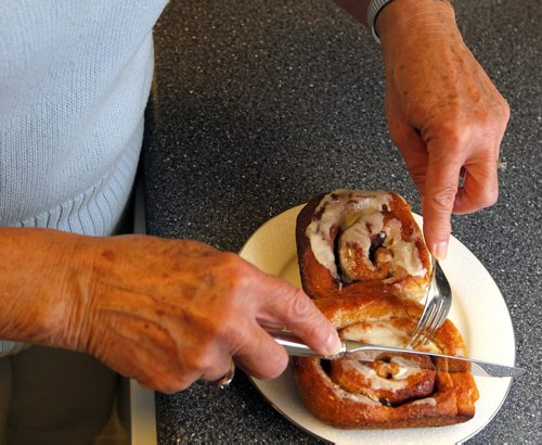 BORIS MINKEVICH / WINNIPEG FREE PRESS 49.8 - Tim Shantz health column. Tim Shantz is putting together different health scenarios for a series of columns. We need a photo of an older woman serving cinnamon buns for this weeks column. May 3, 2016