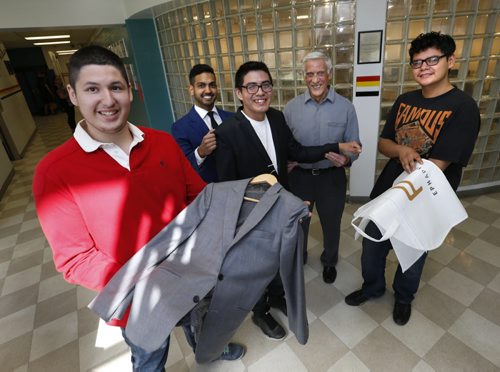 WAYNE GLOWACKI / WINNIPEG FREE PRESS EPH Apparel has agreed to outfit about 17 male Children of the Earth High School grads with suits, ties and shirts for their graduation and prom. In the foreground left to right are grade 12 students Brendan Govereau, Kashtin Mekish trying on a suit jacket and Gordon Parisian with Sandeep Singh, a sales representative with EPH Apparel and retired businessman  Ralph Jackson.  Kevin Rollason  story.     May 4  2016