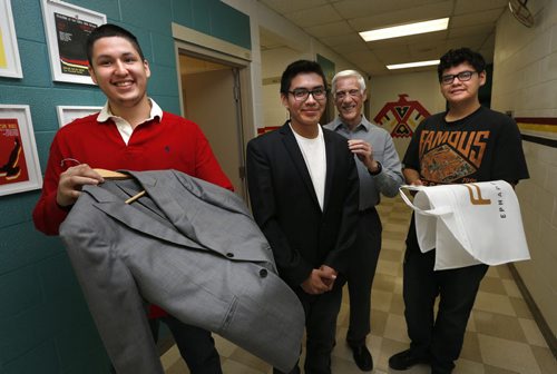 WAYNE GLOWACKI / WINNIPEG FREE PRESS   EPH Apparel has agreed to outfit about 17 male Children of the Earth High School high school grads with suits, ties and shirts for their graduation and prom. In the foreground left to right are grade 12 students Brendan Govereau, Kashtin Mekish trying on a suit jacket and retired businessman Ralph Jackson.  Kevin Rollason  story.     May 4  2016