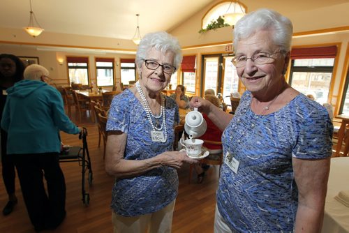 BORIS MINKEVICH / WINNIPEG FREE PRESS VOLUNTEER COLUMN - Column is about, left to right, Helene Wiebe, 84, and Mary Hiebert, 82. They volunteer every Wednesday at Bethania Mennonite Personal Care Home where they serve tea in the tea room from 2 p.m. to 3 p.m. Helene and Mary have volunteered at the care home for 44 years. They have been coordinating their outfits whenever they volunteer for more than 30 years, and are often confused as sisters!  May 4, 2016