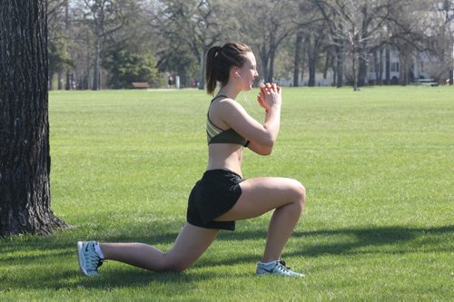 JOE BRYKSA / WINNIPEG FREE PRESS  19 yr old Taylor Kulczycki does some stretches after her run in Assiniboine Park Thursday- Winnipeg could break a temperature record today with highs reaching 31 C , May 05 , 2016.(Standup Photo)
