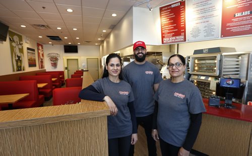 WAYNE GLOWACKI / WINNIPEG FREE PRESS    From left, Rubina Dhillon with her brother Sim Dhillon and mother Pim Dhillon at their Mooyay restaurant on Kenaston Boulevard in the Lindenridge Shopping Centre. Murray McNeill story.     May 5  2016