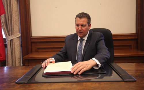 RUTH BONNEVILLE / WINNIPEG FREE PRESS    MLA Cliff Cullen of Brandon area gets settled into his new office at the Manitoba Legislative Building Thursday.  He's still waiting to see what artwork will be placed behind his desk.    May 04, , 2016