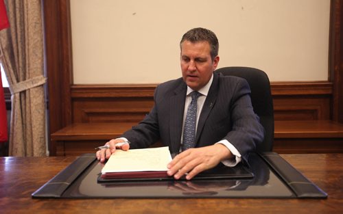 RUTH BONNEVILLE / WINNIPEG FREE PRESS    MLA Cliff Cullen of Brandon area gets settled into his new office at the Manitoba Legislative Building Thursday.  He's still waiting to see what artwork will be placed behind his desk.    May 05, , 2016