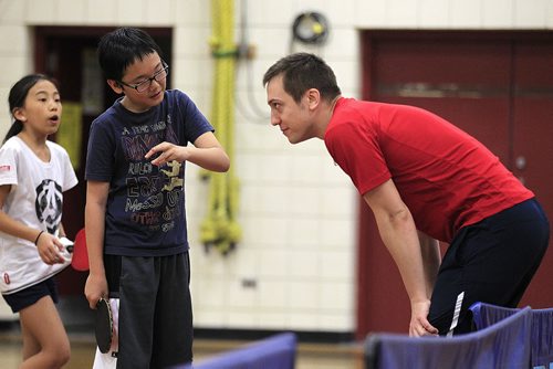 PHIL HOSSACK / WINNIPEG FREE PRESS Team Manitoba table tennis coach Tomas Chromec interacts with some junior players at a team workout Thursday . See Scott Billeck story. May 5, 2016