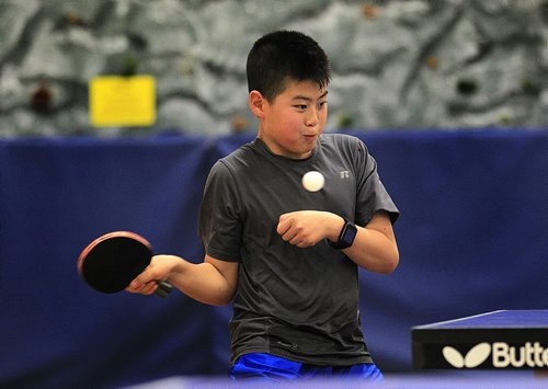 PHIL HOSSACK / WINNIPEG FREE PRESS 12 yr old HongJun Feng fires back a volley Thursday while practicing with the coach team members of Team Manitoba. See Scott Billeck story. May 5, 2016