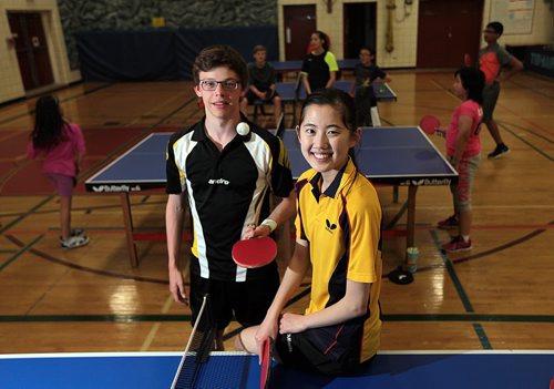 PHIL HOSSACK / WINNIPEG FREE PRESS Matt Lehmann and Jacie Liu pose Thursday while practicing with the coach team members of Team Manitoba and several upcoming junior players behind them. See Scott Billeck story. May 5, 2016
