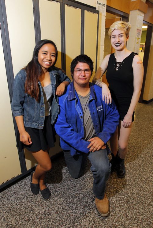 BORIS MINKEVICH / WINNIPEG FREE PRESS Loizza Aquino, Tony Campbell, and Julia Drybrough pose for a photo in the school hallway. Group shot of 3 of 4 students who are being honoured by the city with a youth award as a result of their work to bring mental health awareness, healing and help to their fellow students after the death by suicide of one of their own. May 6, 2016