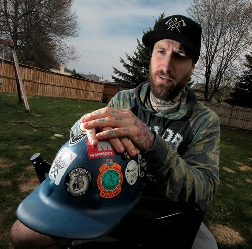 PHIL HOSSACK / WINNIPEG FREE PRESS - Joshua Sleigh poses in his Winnipeg back yard Friday. A scaffolder in Fort McMurray, just got back, is selling Fort McMurray Hardhat Stickers to raise funds for Fort McMurray victims. ill Redkopp's story. May 6, 2016