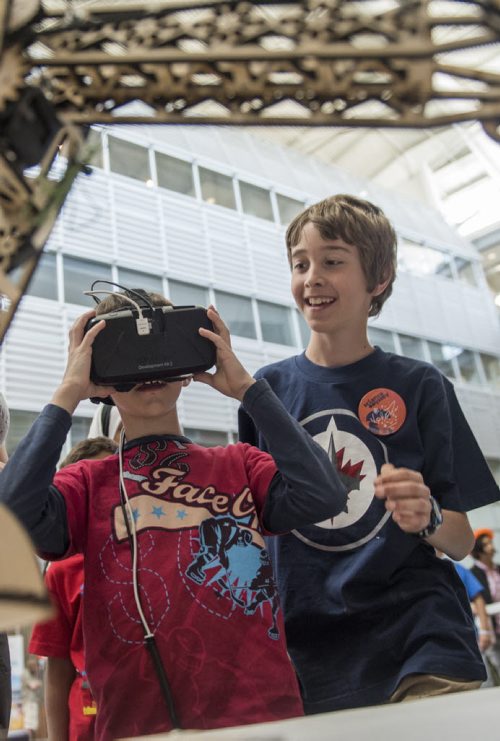 DAVID LIPNOWSKI / WINNIPEG FREE PRESS  Brothers Connor (left) and Kaden try out a virtual reality headset during Science Rendezvous in the Engineering Atrium at the University of Manitoba Saturday, May 7, 2016.