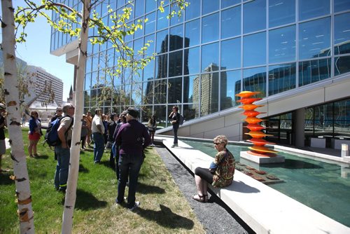 RUTH BONNEVILLE / WINNIPEG FREE PRESS  Public Art Coordinator  Alixis Kinloch, explains some of the outdoor art in the grounds of the Millennium Library to a group of art enthusiasts during a free public art tour Saturday put on by the Winnipeg Arts Council   Standup photo   May 07, , 2016