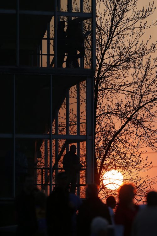 JOHN WOODS / WINNIPEG FREE PRESS Race fans await the next race as the sun sets on opening day at Assiniboin Downs  Sunday, May 8, 2016.