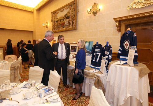 JASON HALSTEAD / WINNIPEG FREE PRESS  Attendees check out auction items at the annual In the Mood Gala frundraiser for the Mood Disorders Association of Manitoba on April 23, 2016, at the Fort Garry Hotel.   (See Social Page)