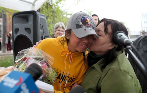 RUTH BONNEVILLE / WINNIPEG FREE PRESS  17-year-old Métis girl Kayleen McKay Is kissed by her grandmother Mary Pangman after being congratulated by supporters after she completed her goal of running 420 kilometers to raise money for Drag the Red  at the Alexander Docks on Waterfront Drive Tuesday.    May 10, , 2016