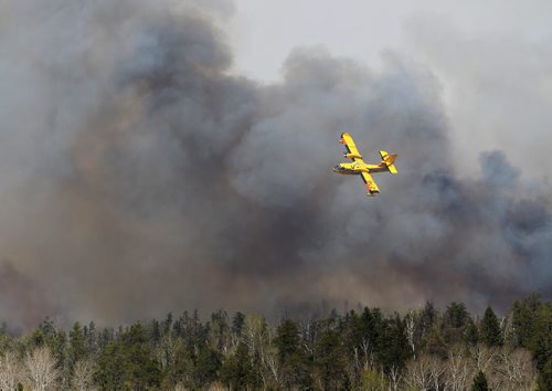JOE BRYKSA / WINNIPEG FREE PRESS Heavy winds Tuesday have intensified the forest fires on the east side of Caddy Lake in the Whiteshell, May,10 , 2016.(See Bill Redekop story)