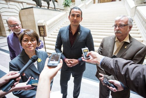 MIKE DEAL / WINNIPEG FREE PRESS NDP Interim Leader Flor Marcelino announces the critic roles for the newly sworn-in NDP caucus Tuesday afternoon at the foot of the Grand Staircase in the Manitoba Legislative Building. She was accompanied by NDP MLA's Wab Kinew (centre) and Tom Lindsey (right). 160510 - Tuesday, May 10, 2016