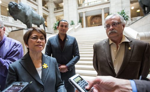 MIKE DEAL / WINNIPEG FREE PRESS NDP Interim Leader Flor Marcelino announces the critic roles for the newly sworn-in NDP caucus Tuesday afternoon at the foot of the Grand Staircase in the Manitoba Legislative Building. She was accompanied by NDP MLA's Wab Kinew (centre) and Tom Lindsey (right). 160510 - Tuesday, May 10, 2016