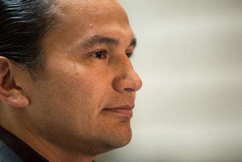 MIKE DEAL / WINNIPEG FREE PRESS NDP's Wab Kinew, MLA for Fort Rouge listens as Interim Leader Flor Marcelino announces the critic roles for the newly sworn-in NDP caucus Tuesday afternoon at the foot of the Grand Staircase in the Manitoba Legislative Building. 160510 - Tuesday, May 10, 2016