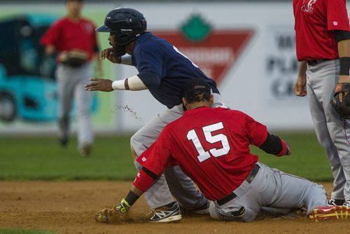 MIKE DEAL / WINNIPEG FREE PRESS Winnipeg Goldeyes' Casio Grider (9) steals second base while Fargo-Moorhead Redhawks first baseman Charlie Valerio tries to catch him in the second inning of the last home exhibition game against Fargo-Moorhead Redhawks Wednesday evening.  160511 - Wednesday, May 11, 2016