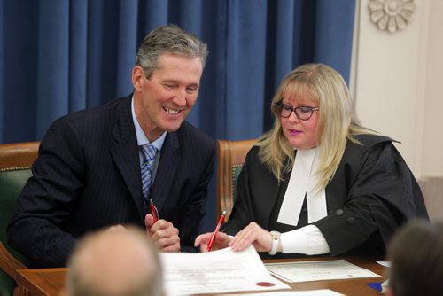 BORIS MINKEVICH / WINNIPEG FREE PRESS Progressive Conservative Caucus to be sworn in. Official swearing-in ceremony for the 41st Legislature. Room 200, Manitoba Legislature. Manitoba Premier Brian Pallister signs papers at swearing in ceremony. May 11, 2016.