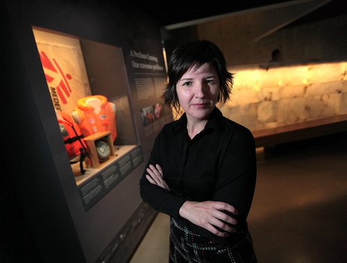 PHIL HOSSACK / WINNIPEG FREE PRESS -  Isabelle Masson, a CMHA Curator who adapted the Medicine Sans Frontieres exhibit for The Canadian Human RIghts Museum poses in front of the display Wednesday. The exhibit opens Thursday. See release / story.  May 10, 2016