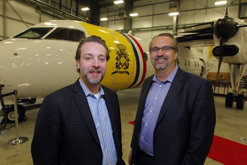 BORIS MINKEVICH / WINNIPEG FREE PRESS Exchange Income Corp. a.g.m. Bria Chafe, CEO of Provincial Aerospace Ltd. out of Newfoundland with Exchange Income Corp. CEO Mike Pyle. Behind is a Dash 8 100 MPA Maritime surveillance plane that is part of the company's east coast operation. May 11, 2016.