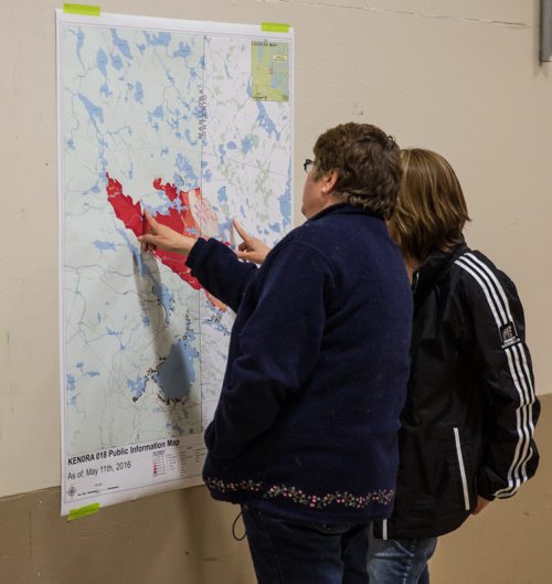MIKE DEAL / WINNIPEG FREE PRESS Area residents gather at the Whitehall Community Hall in Falcon Lake for an information meeting put together by Manitoba and Ontario fire officials for those affected by the Caddy Lake fire Thursday evening. 160512 - Thursday, May 12, 2016