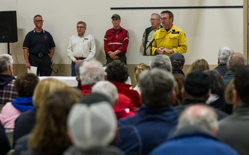 MIKE DEAL / WINNIPEG FREE PRESS Geoff Smith a Conservation Officer with Manitoba Sustainable Development talks to area residents who gathered at the Whitehall Community Hall in Falcon Lake for an information meeting put together by Manitoba and Ontario fire officials for those affected by the Caddy Lake fire Thursday evening. 160512 - Thursday, May 12, 2016