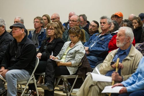 MIKE DEAL / WINNIPEG FREE PRESS Area residents gather at the Whitehall Community Hall in Falcon Lake for an information meeting put together by Manitoba and Ontario fire officials for those affected by the Caddy Lake fire Thursday evening. 160512 - Thursday, May 12, 2016