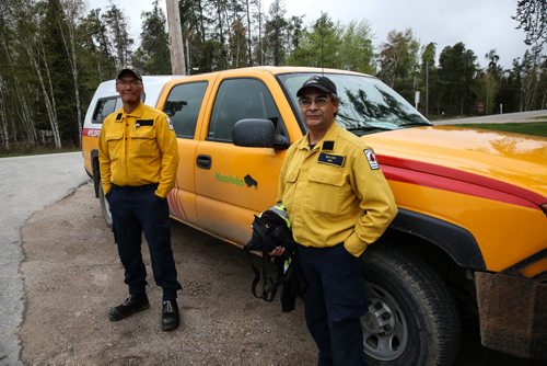 MIKE DEAL / WINNIPEG FREE PRESS Outside the Whiteshell Fire Hall, Justin Moose (left) and Earl Nice (right) are district fire rangers from northern Manitoba who have been assigned to one of the value protection crews have spent the last few days setting up sprinklers on structures to protect them from the Caddy Lake fire. 160512 - Thursday, May 12, 2016